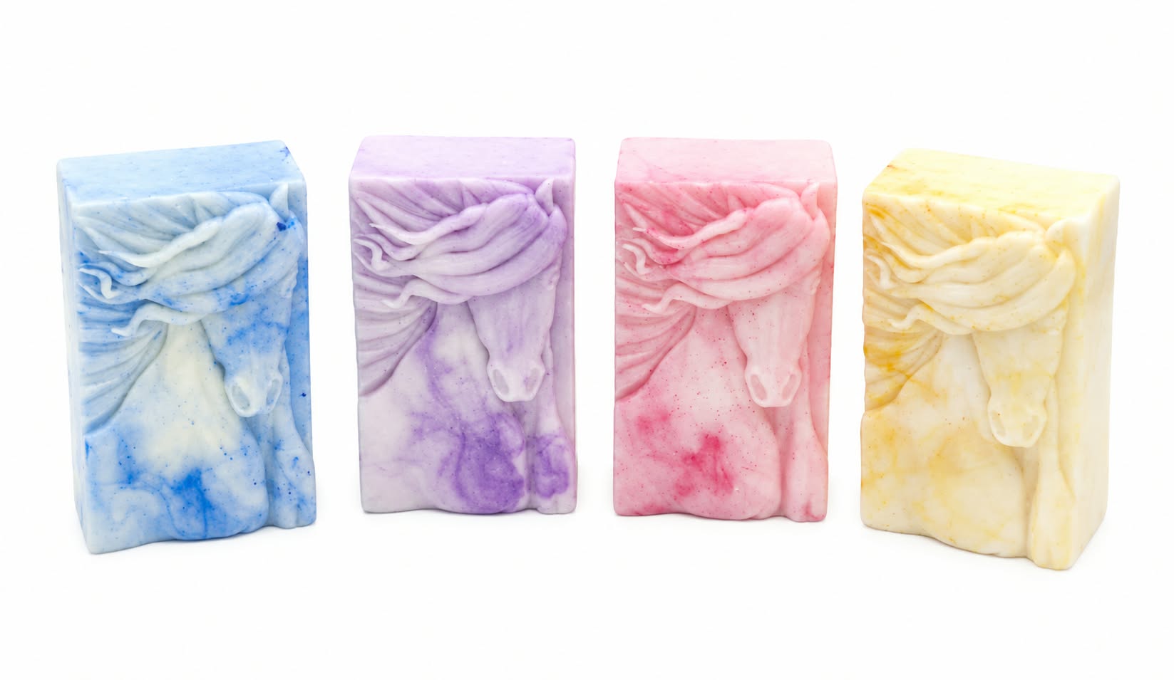Set of 4 bars of soaps with a horse head on them.