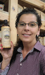 Woman holding a bottle of Original Skin Repair No. 01